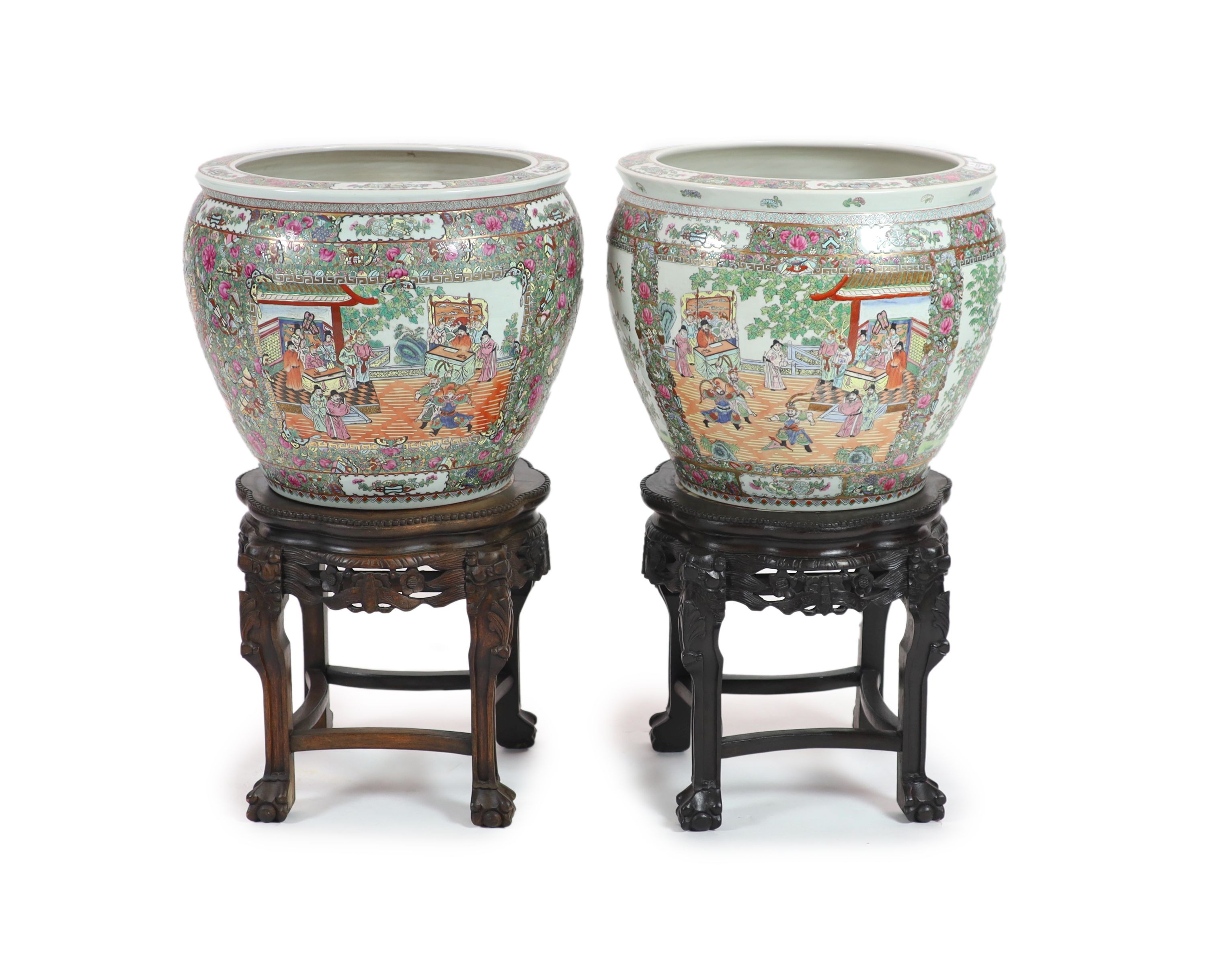 A pair of Chinese famille rose gold fish bowls, 56cm diameter with ebonised and marble inset stands, total height 91cm